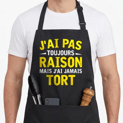 Tablier de cuisine noir avec inscription jaune et blanche J'ai pas toujours raison mais j'ai jamais tort.