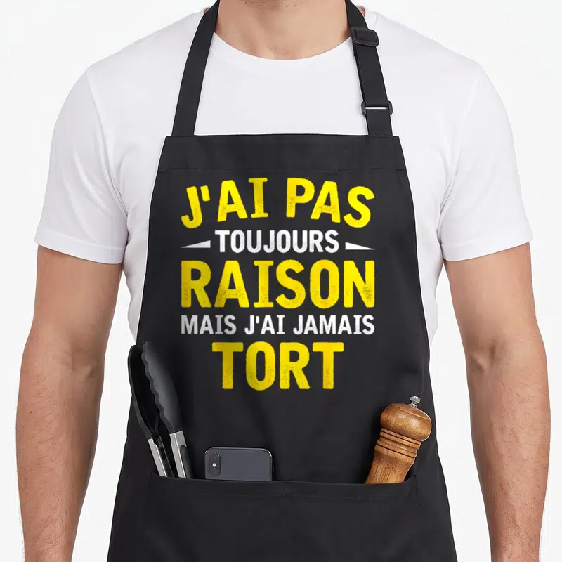 Tablier de cuisine noir avec inscription jaune et blanche J'ai pas toujours raison mais j'ai jamais tort.