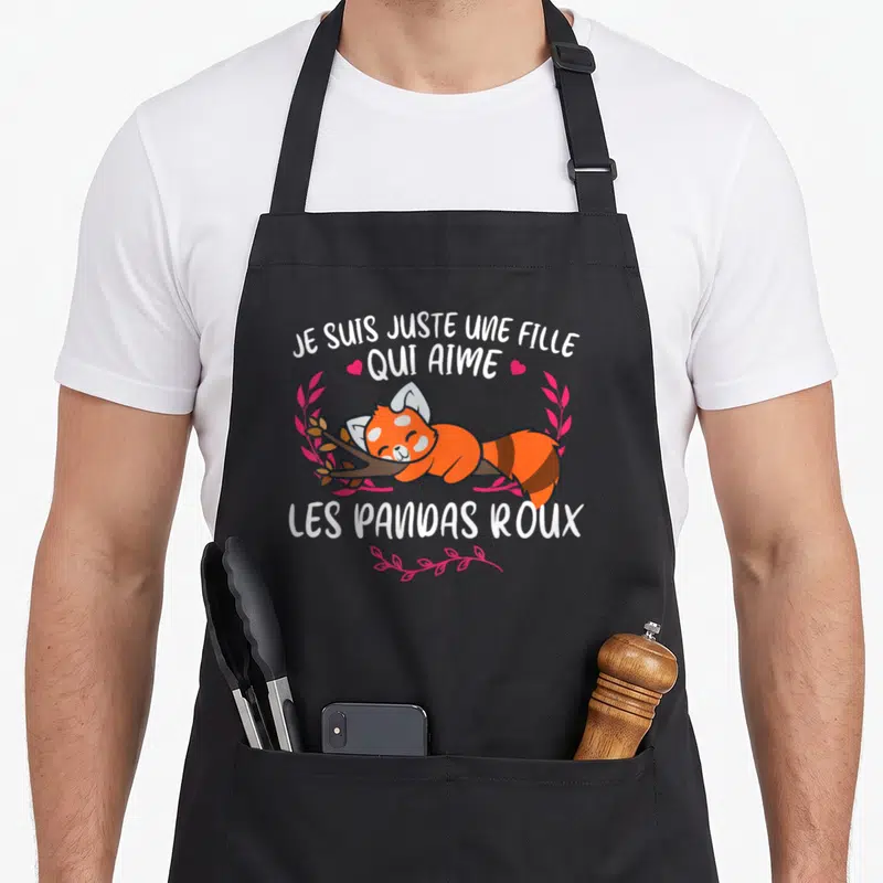 Tablier de cuisine noir avec un panda roux dormant et le texte Je suis juste une fille qui aime les pandas roux.