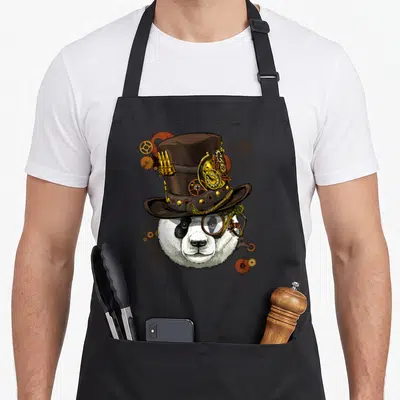 Tablier de cuisine noir avec illustration d'un panda portant un chapeau haut de forme et une lunette monocle steampunk.