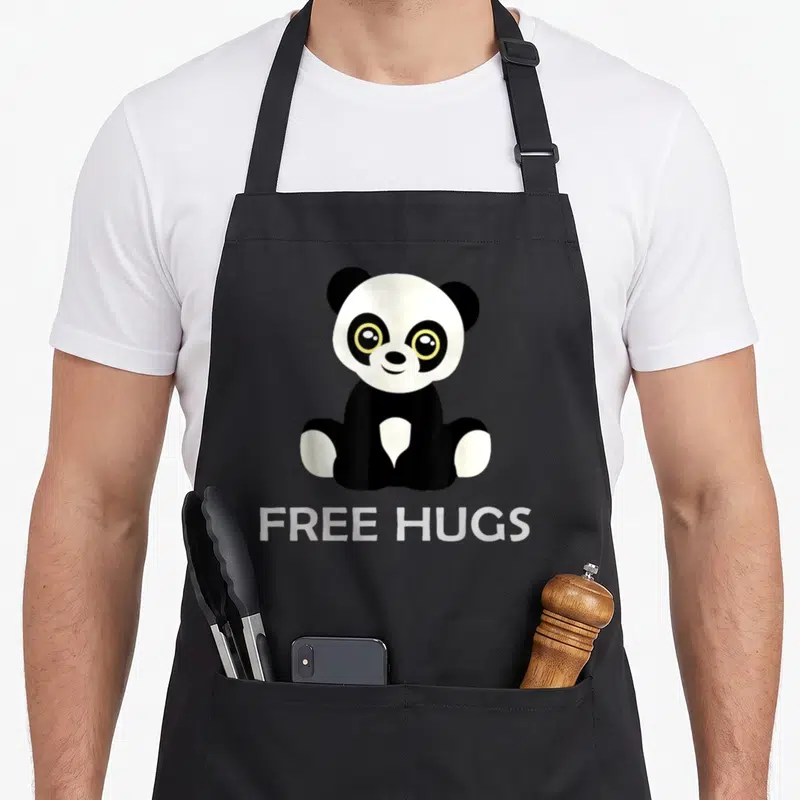 Tablier de cuisine noir avec un panda assis et l'inscription Free Hugs en blanc
