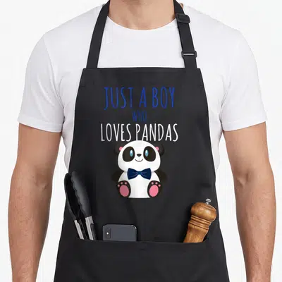Tablier de cuisine noir avec un panda kawaii portant une cravate et le texte Just a boy who loves pandas.