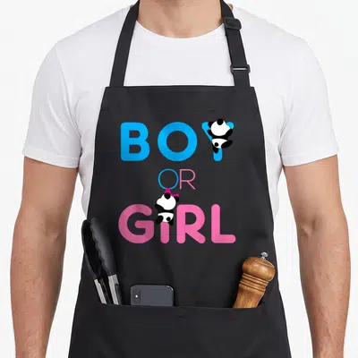 Tablier de cuisine noir avec les mots Boy or Girl en bleu et rose et deux petits pandas illustrés.
