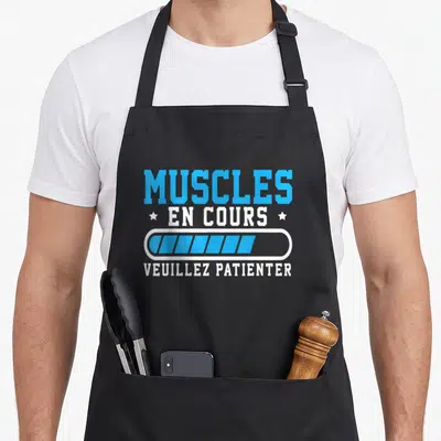 Tablier de cuisine noir avec le texte Muscles en cours et une barre de progression bleue.