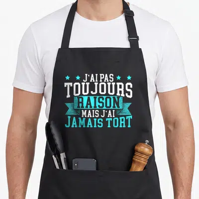 Tablier de cuisine noir avec inscription blanche et turquoise J'ai pas toujours raison mais j'ai jamais tort entouré d'étoiles.