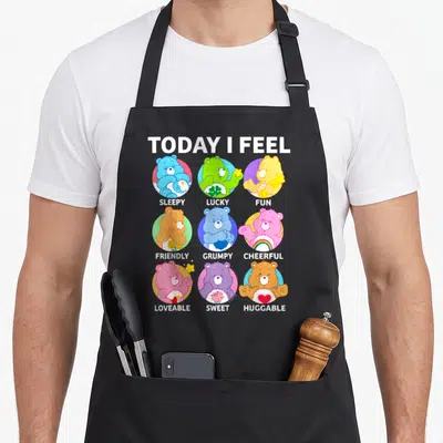 Tablier de cuisine noir avec neuf ours colorés et les mots Today I Feel Sleepy Lucky Fun Friendly Grumpy Cheerful Loveable Sweet Huggable