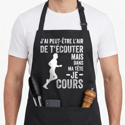 Tablier de cuisine noir avec une silhouette de course à pied et le texte j'ai peut-être l'air de t'écouter mais je cours.