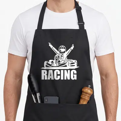 Tablier de cuisine noir avec illustration blanche d'un pilote de kart levant les bras sous le mot RACING