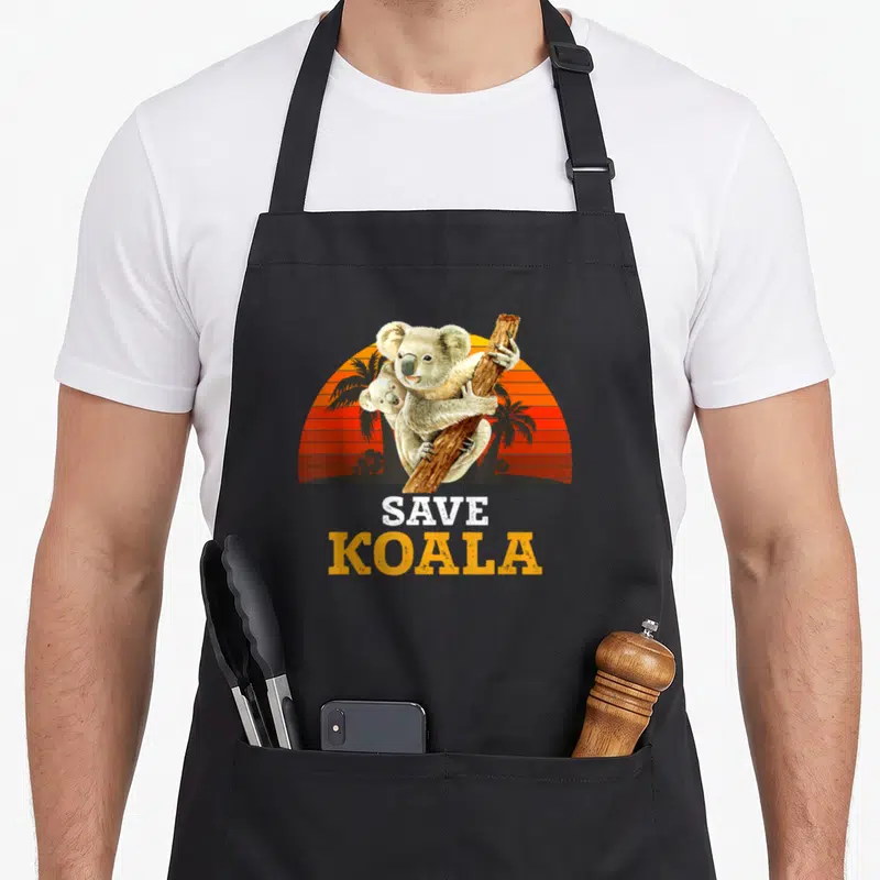 Tablier de cuisine noir avec deux koalas et le texte Save Koala sur fond de soleil orange.