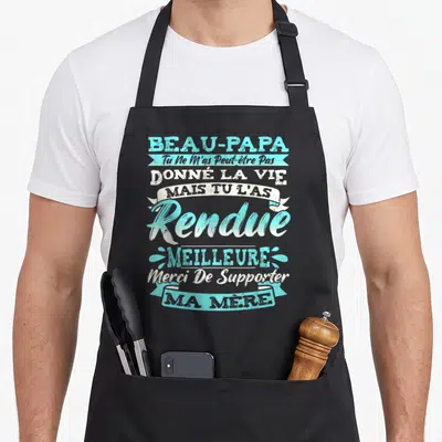 Tablier de cuisine noir avec inscription typographique turquoise et blanche honorant un beau-papa