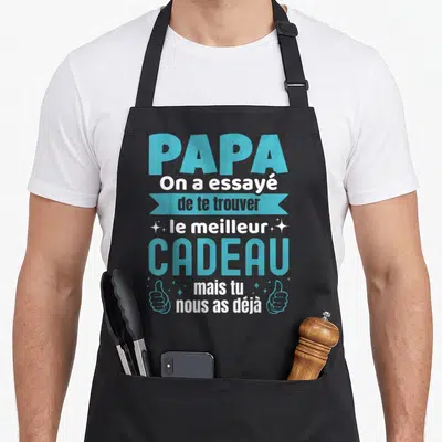 Tablier de cuisine noir avec inscription bleue et blanche Papa On a essayé de te trouver le meilleur cadeau mais tu nous as déjà flanqué de deux pouces levés.