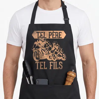 Tablier de cuisine noir avec illustration orange Tel Père Tel Fils Motard et silhouettes de cyclomoteurs.