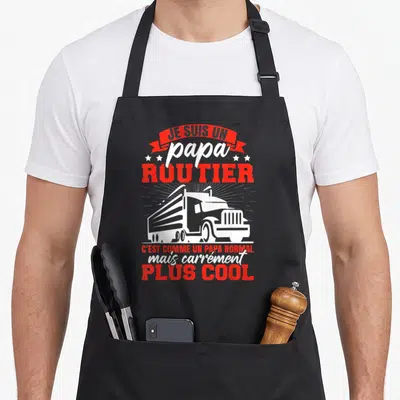 Tablier de cuisine noir avec inscription Je suis un papa routier et illustration de camion blanc sur fond rouge et noir.
