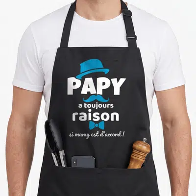 Tablier de cuisine noir avec l'inscription Papy a toujours raison et des éléments graphiques bleus élégants.