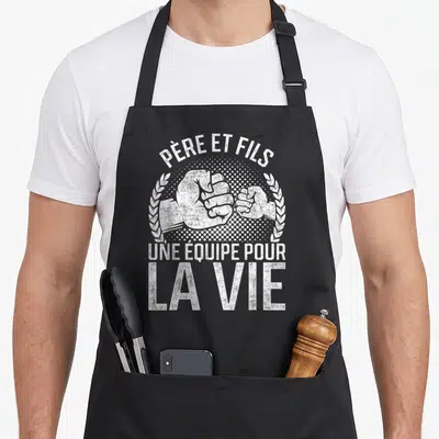Tablier de cuisine noir avec poings se touchant et texte blanc Père et fils une équipe pour la vie.
