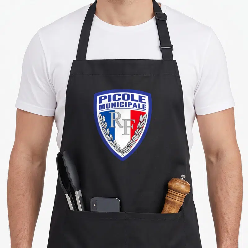 Tablier de cuisine noir avec l'insigne bleu blanc rouge Picole Municipale RF au centre.