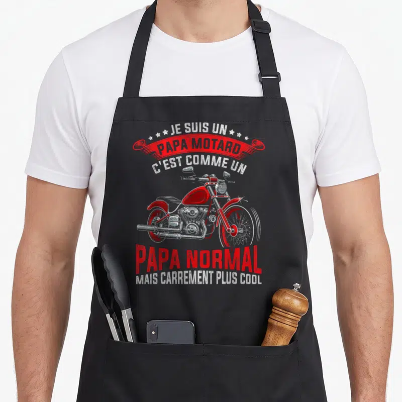 Tablier de cuisine noir avec illustration moto vintage rouge et texte Je suis un papa motard carrément plus cool.
