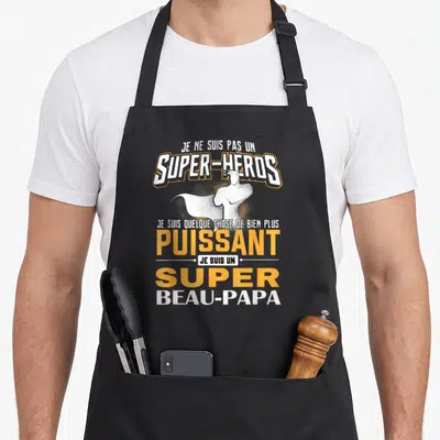 Tablier de cuisine noir avec illustration de super-héros et texte Je suis un super beau-papa puissant en orange et blanc.