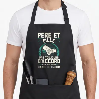 Tablier de cuisine noir avec l'inscription Père et Fille et une illustration de mains se tenant.