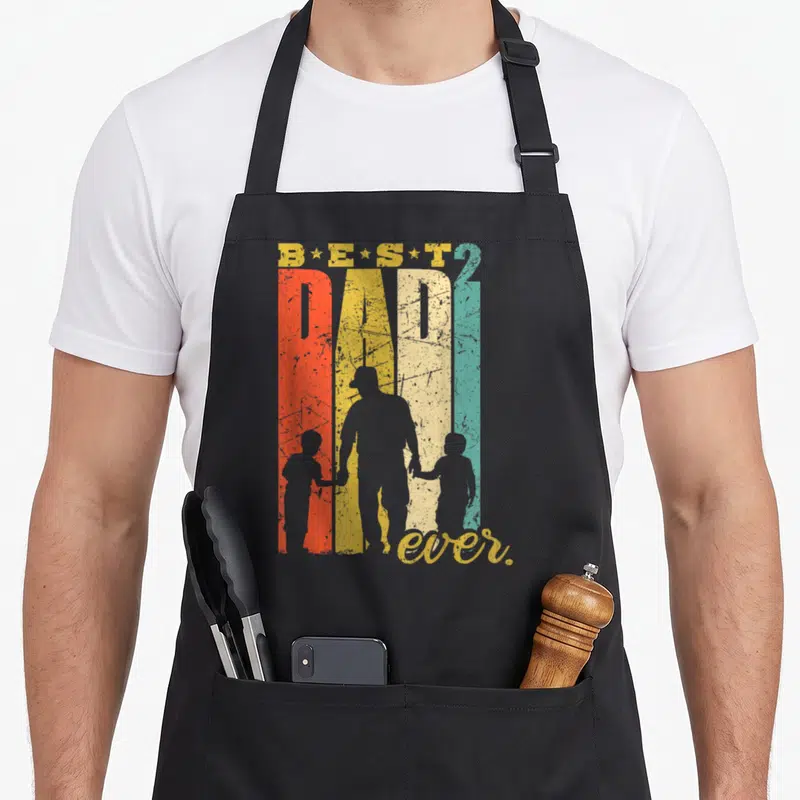 Tablier de cuisine noir avec illustration vintage Best Dad 2 fils et silhouettes d'un père tenant la main de deux enfants.