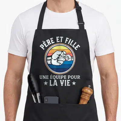 Tablier de cuisine noir avec poings se touchant et texte Père et Fille Une équipe pour la vie.
