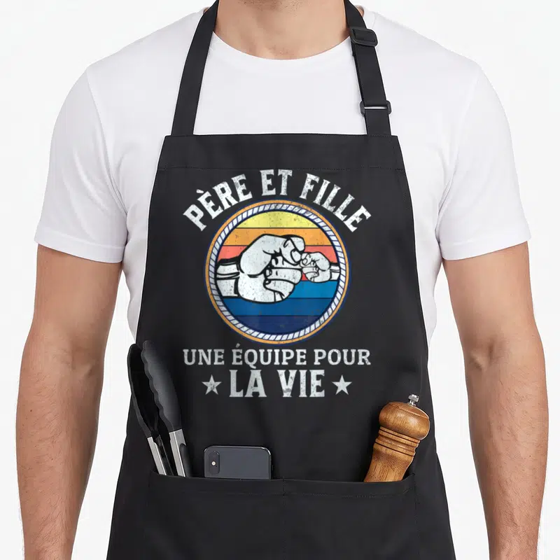 Tablier de cuisine noir avec poings se touchant et texte Père et Fille Une équipe pour la vie.