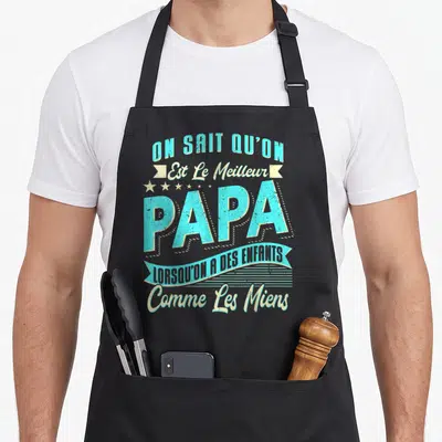 Tablier de cuisine noir avec inscription On sait qu'on est le meilleur papa lorsqu'on a des enfants comme les miens en bleu et blanc.
