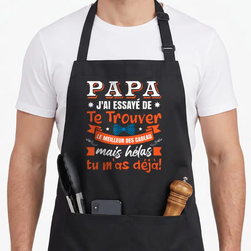 Tablier de cuisine noir avec texte blanc et orange Papa j'ai essayé de te trouver le meilleur des cadeaux mais hélas tu m'as déjà.