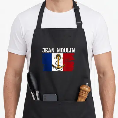 Tablier de cuisine noir avec inscription Jean Moulin, ancre dorée et drapeau tricolore stylisé.