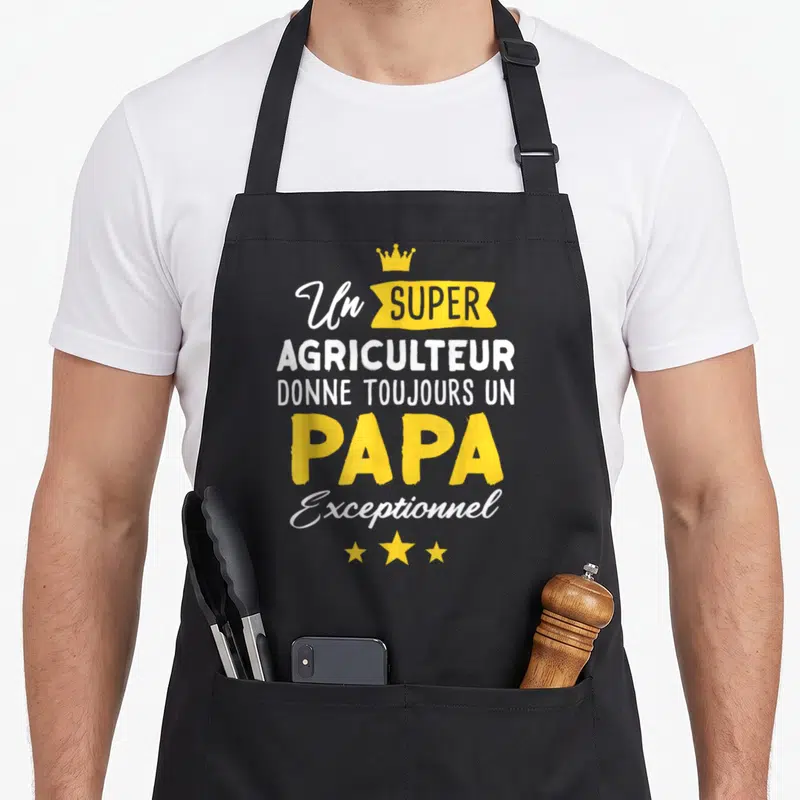 Tablier de cuisine noir avec inscription Un super agriculteur donne toujours un papa exceptionnel et une couronne jaune.