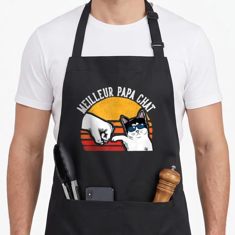 Tablier de cuisine noir avec un chat aux lunettes de soleil et l'inscription Meilleur Papa Chat en style vintage.
