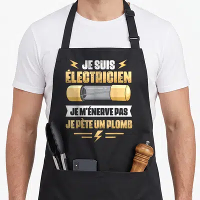 Tablier de cuisine noir avec illustration de fusible et texte humoristique sur le métier d'électricien.