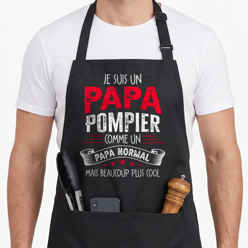 Tablier de cuisine noir avec inscription Je suis un papa pompier comme un papa normal mais beaucoup plus cool en rouge et blanc.