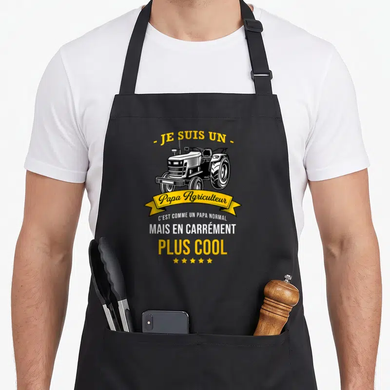 Tablier de cuisine noir avec illustration de tracteur et banderole jaune Papa Agriculteur plus cool