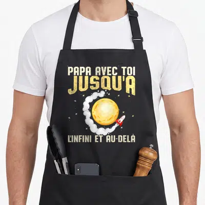 Tablier de cuisine noir avec inscription spatiale Papa avec toi jusqu'à l'infini et au-delà et une fusée.
