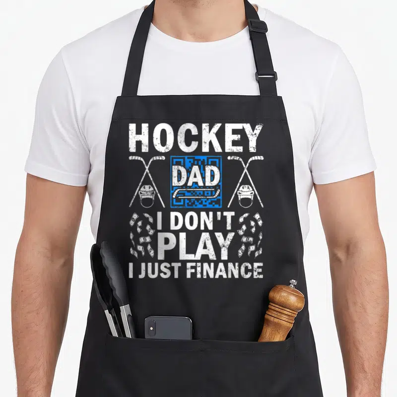Tablier de cuisine noir avec inscription blanche Hockey Dad et illustrations de crosse et casque de hockey.