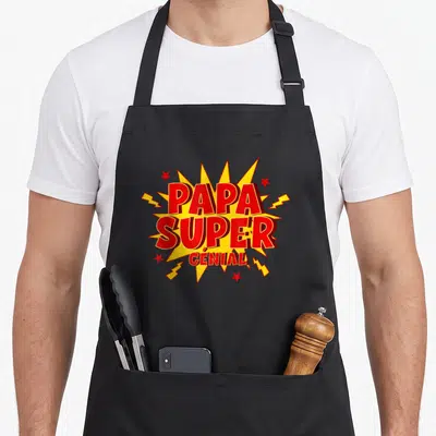 Tablier de cuisine noir avec une illustration comics rouge et jaunePapa Super Génial