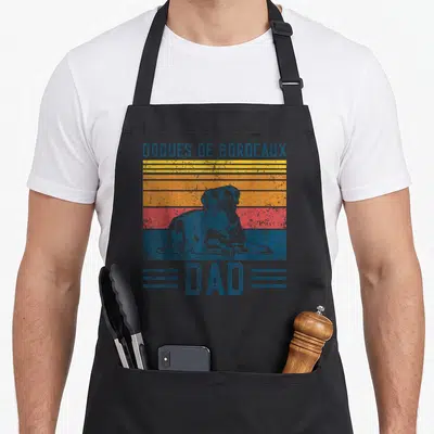 Tablier de cuisine noir avec illustration vintage d'un Dogue de Bordeaux posant sur bandes colorées et le mot Dad en bas.