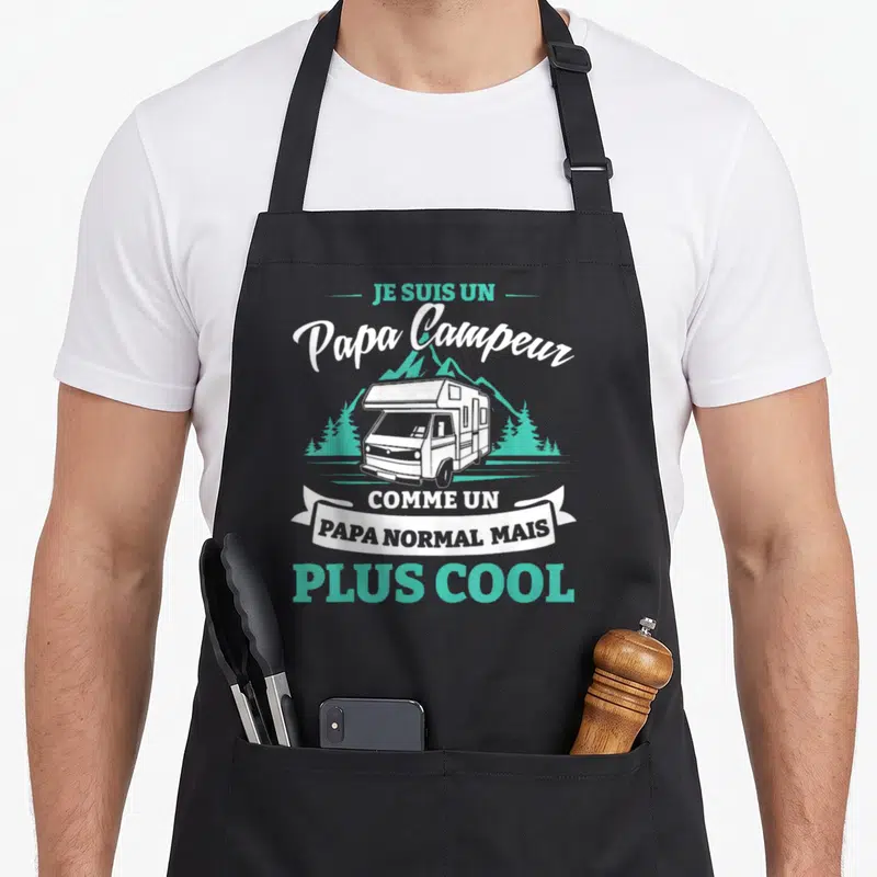 Tablier de cuisine noir avec illustration de camping-car et texte Je suis un Papa Campeur plus cool en blanc et turquoise.
