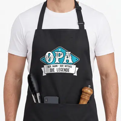 Tablier de cuisine noir avec emblème bleu OPA Der Mann Der Mythos Die Legende et étoile blanche.