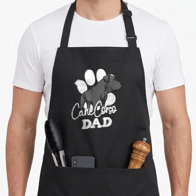 Tablier de cuisine noir avec illustration Cane Corso Dad et grande patte blanche stylisée en arrière-plan.