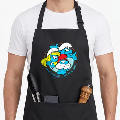 Tablier de cuisine noir avec Papa Smurf, Smurfette et un companon bleu affichant le slogan One for all All for One.