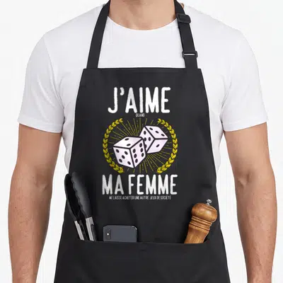 Tablier de cuisine noir avec dice roses et texte J'aime quand ma femme me laisse acheter une autre jeux de société.