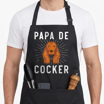 Tablier de cuisine noir avec illustration de chien Cocker et texte blanc « Papa de Cocker ».