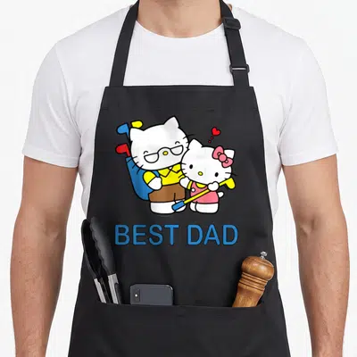 Tablier de cuisine noir avec deux chats jouant au golf et l'inscription Best Dad en bleu.
