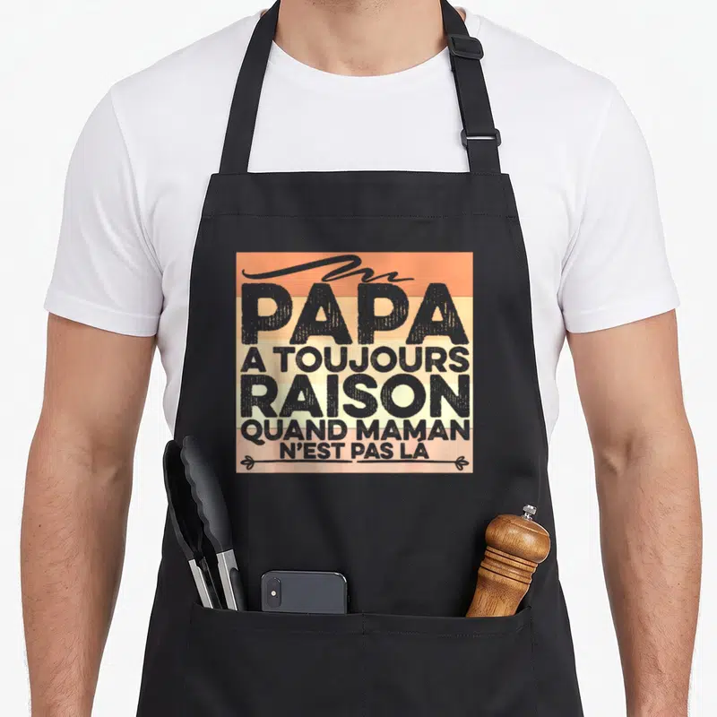 Tablier de cuisine noir avec inscription Papa a toujours raison quand maman n'est pas la sur fond orange et beige