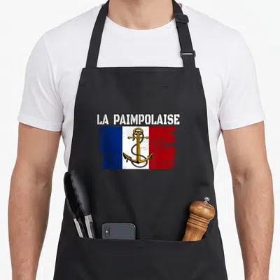 Tablier de cuisine noir avec une ancre dorée sur fond tricolore et texte La Paimpolaise