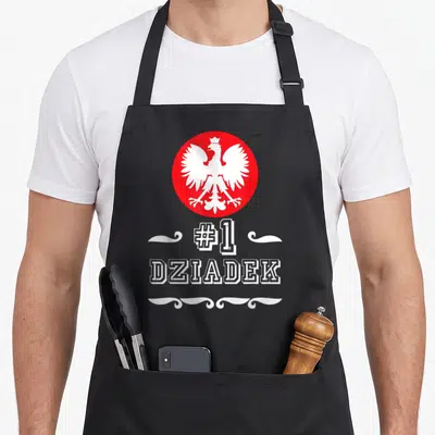Tablier de cuisine noir avec un aigle blanc dans un cercle rouge et le texte #1 DZIADek en blanc.