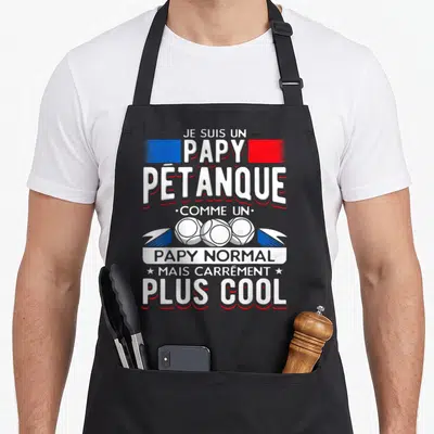 Tablier de cuisine noir avec texte blanc et rouge Je suis un papy pétanque plus cool et trois boules de boccia.