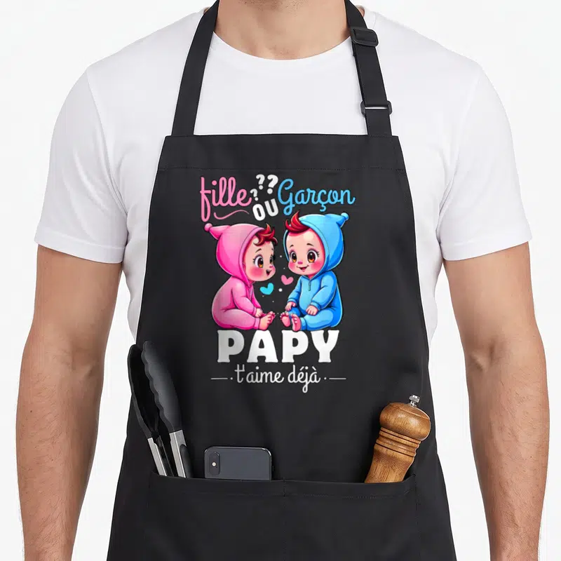 Tablier de cuisine noir avec illustration de deux bébés rose et bleu et le texte Papy t'aime déjà.